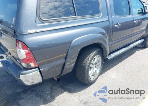 2015 Toyota Tacoma Base V6 z USA, uszkodzony, nr VIN 3TMLU4EN1FM177255